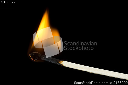 Image of Burning flame on a  matchstick 