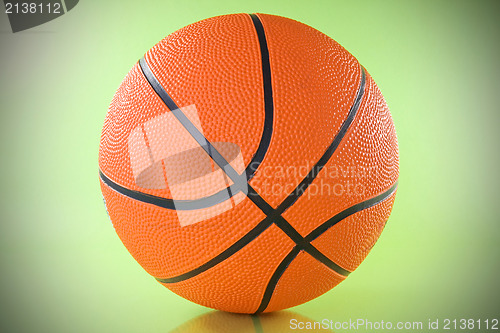Image of basketball ball over a green background