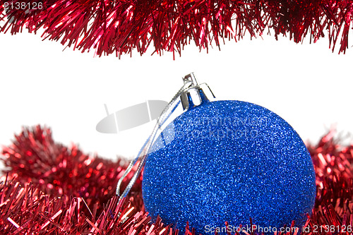 Image of Christmas tinsel and blue bauble