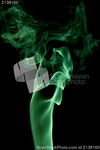 Image of green  smoke on black