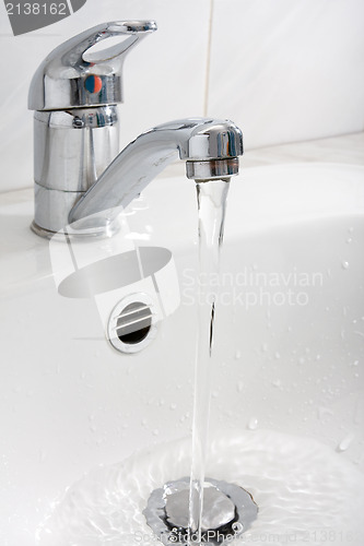 Image of water running down from the faucet