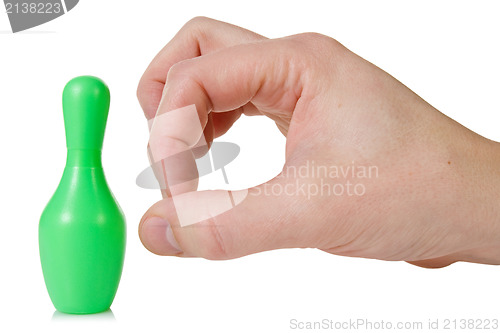 Image of hand flicks a bowling pin