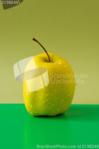 Image of apple on green background