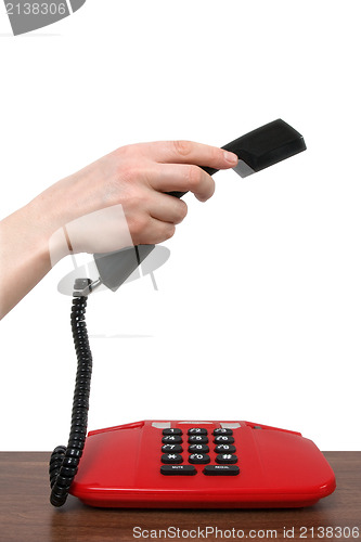 Image of Telephone receiver in a  hand