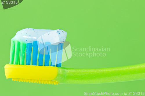 Image of toothbrush on green background