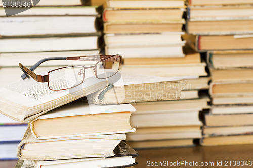 Image of glasses on stack of books