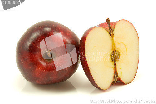 Image of apple and half over a white background