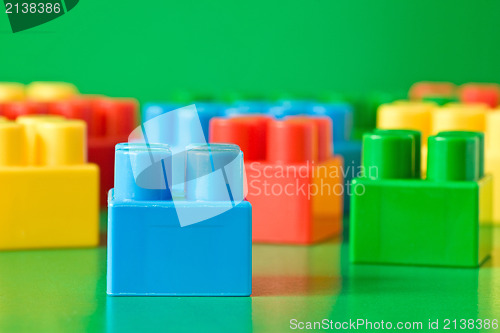 Image of colorful  blocks on green background