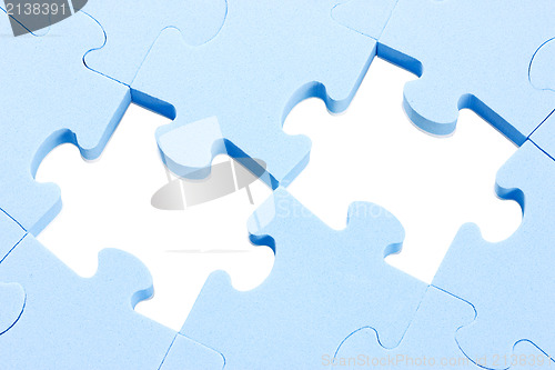 Image of puzzle background with two missing pieces 