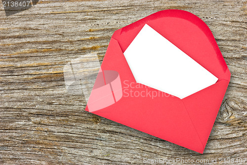 Image of Red envelope on wooden background