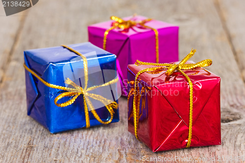Image of Thre gifts on the wooden floor