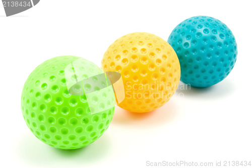 Image of three colored golf balls