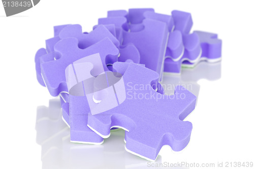 Image of pile of purple puzzle