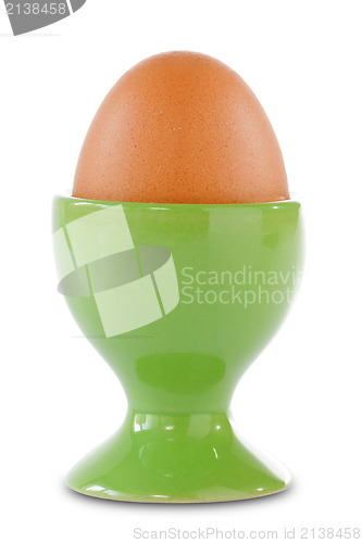 Image of Brown egg in a green cup