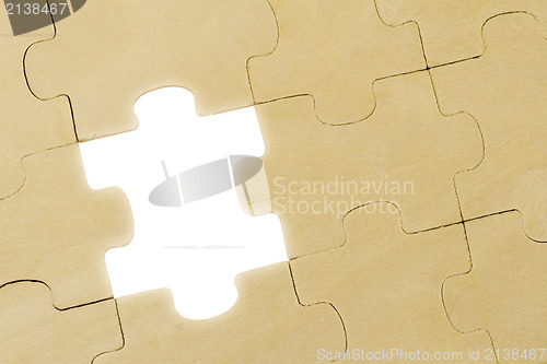 Image of puzzle with one piece missing