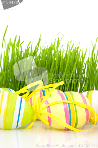 Image of multicolored easter eggs and green  grass