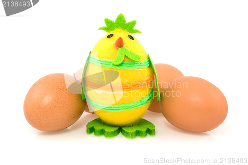 Image of funny easter chick and brown eggs