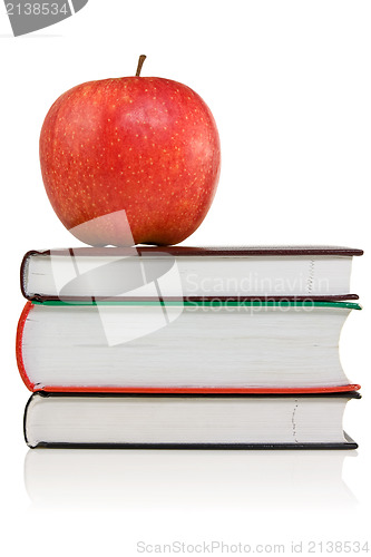 Image of books with a red apple on the top