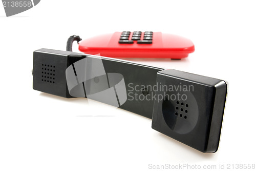 Image of red telephone with black receiver