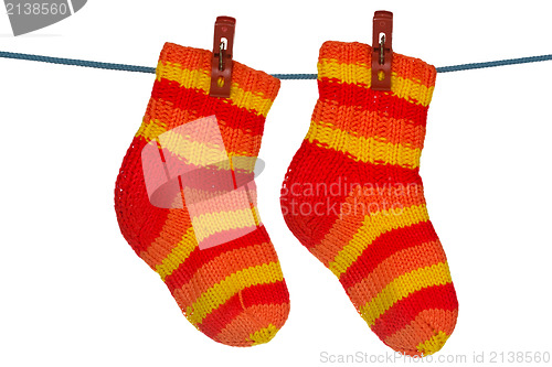 Image of Knitted socks hung on the rope