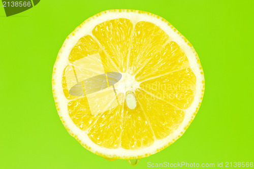 Image of Lemon slice on green background