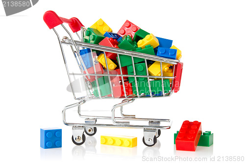 Image of color plastic bricks  in a shopping cart