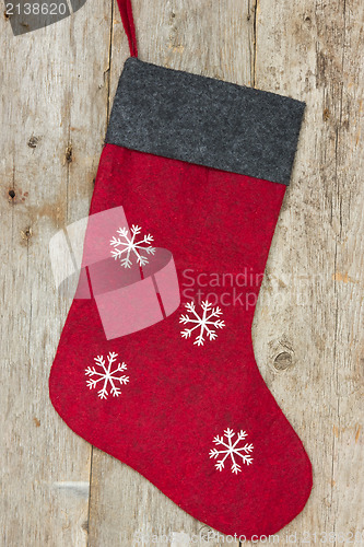 Image of christmas sock hung on the wooden wall