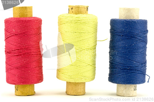 Image of three thread spools