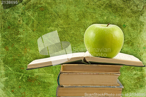 Image of school books and apple