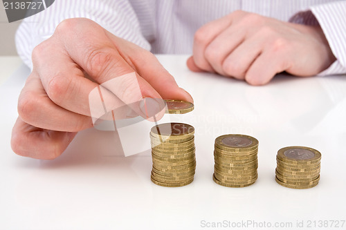 Image of hand putting coins