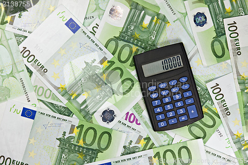 Image of black calculator and euro currency