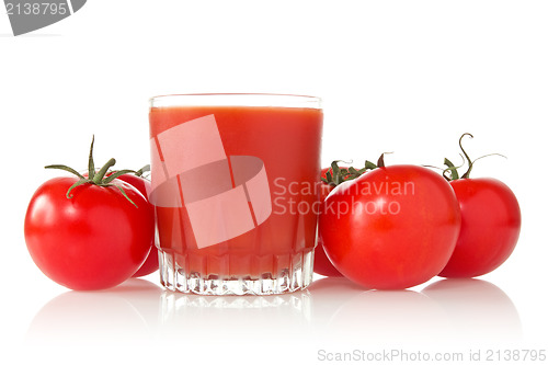 Image of ripe tomatoes and glass of tomato juice