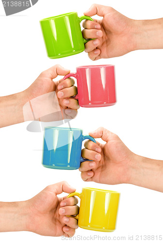 Image of four hands with colorful cups