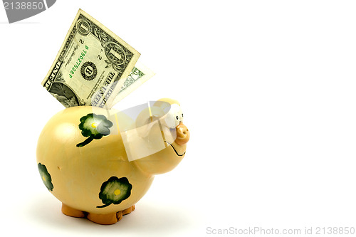 Image of piggy bank with one dollar