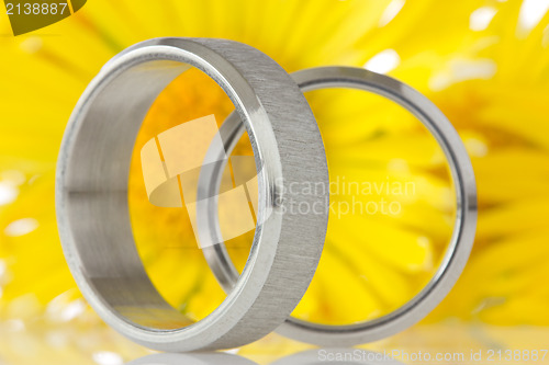 Image of silver rings with yellow flowers