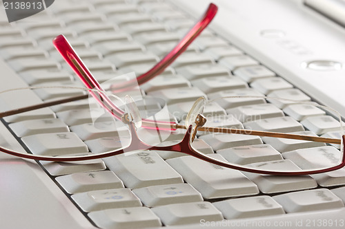 Image of glasses on the computer keyboard