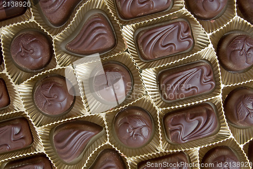 Image of  chocolate pralines in a golden box