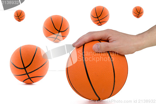 Image of player hand and many orange balls