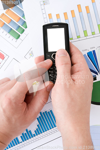 Image of businessman's hands with phone