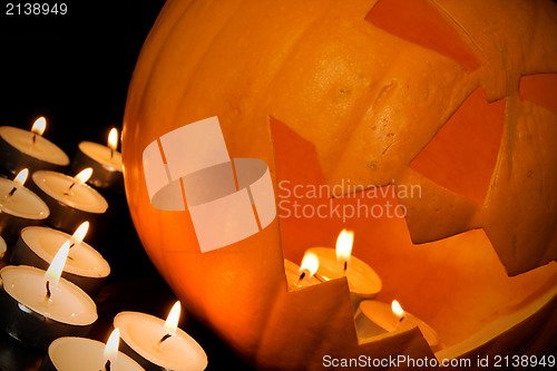 Image of  halloween pumpkin and candles