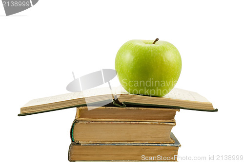 Image of open book with green apple