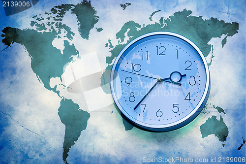 Image of world map with wall clock