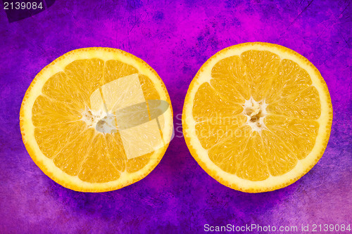 Image of orange fruit on grunge purple background