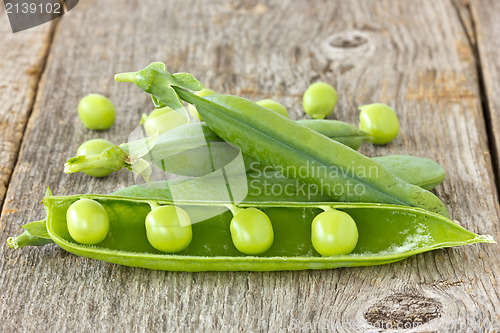 Image of peas on the  wooden background