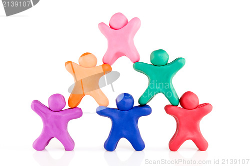 Image of  plasticine guys making a human pyramid 