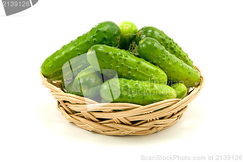 Image of wicker dish with cucumbers