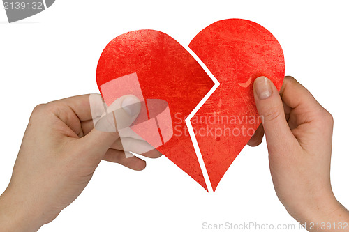 Image of male and female holding broken heart