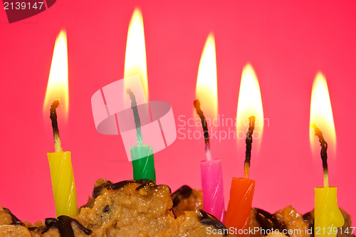 Image of birthday candles against red background