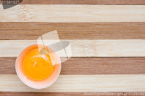Image of egg on a wooden background