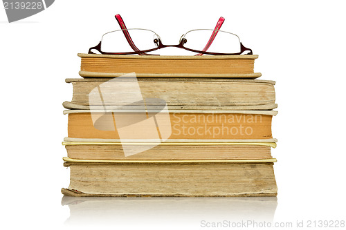 Image of stack of books with glasses 
